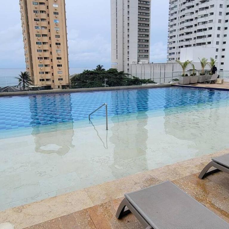 Stunning Infinity Pool, Balcony, steps from Walled City & Marbella Beach - Three-Bedroom Apartment - 1