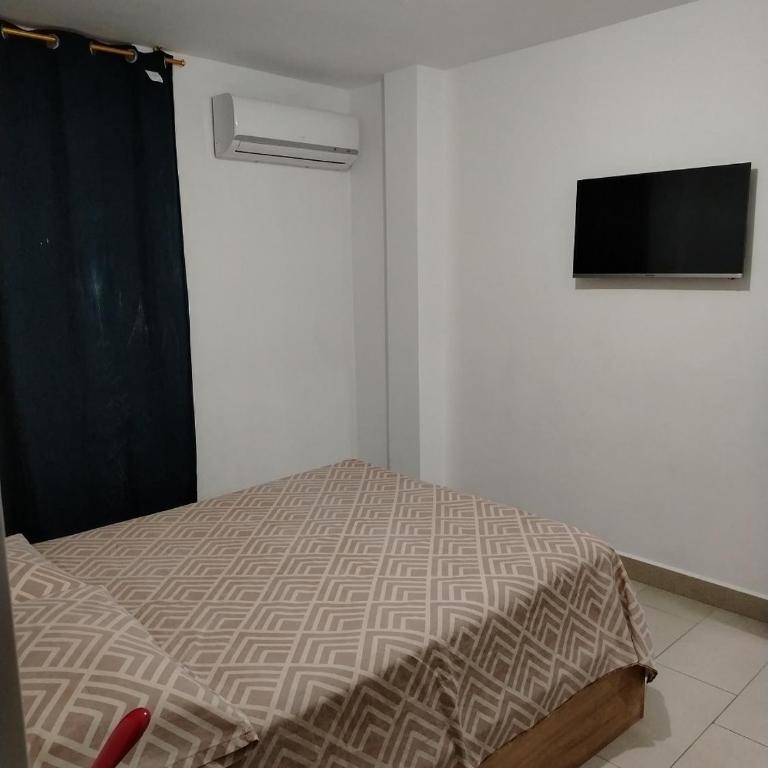 Casa familiar cerca a la playa - Three-Bedroom House - 18