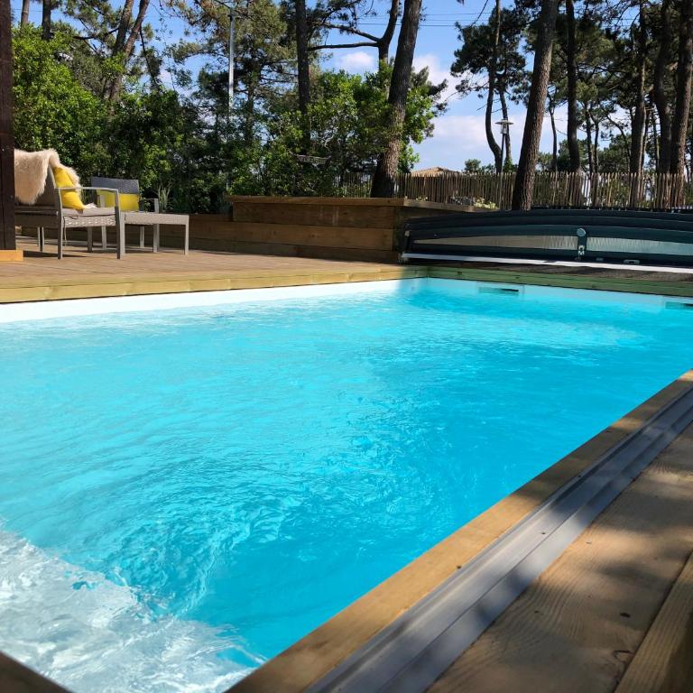 Chambre Cap-Ferret-Piscine chauffée-Villa Sylhengui - Chambre Double ou Lits Jumeaux - Vue sur Piscine - 9