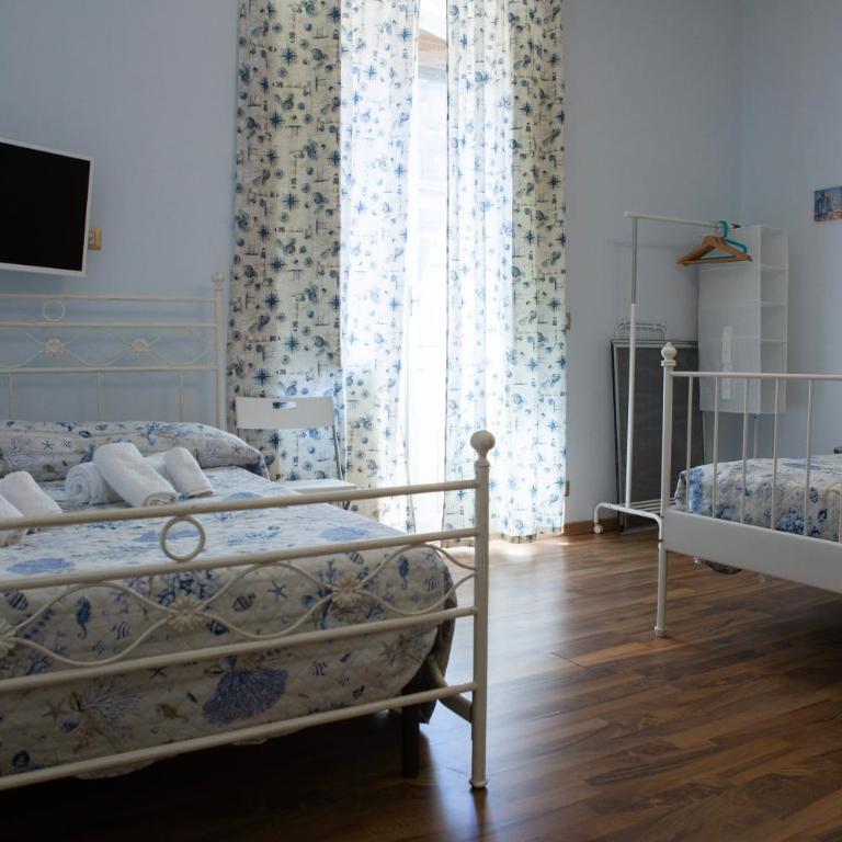 I VACANZIERI - Camera Deluxe (2 Adulti + 1 Bambino) - 6
