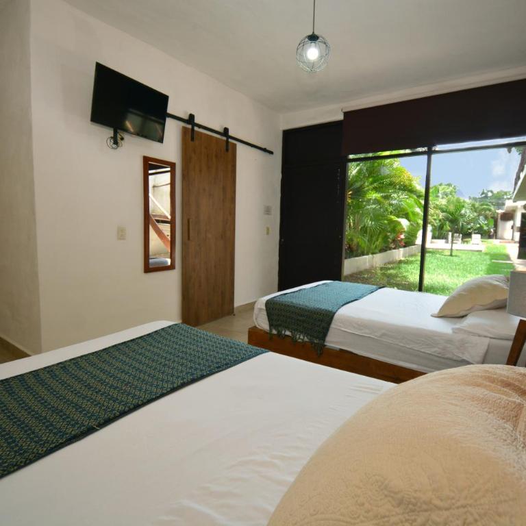 Casa Delia Hotel Downtown - Habitación Cuádruple - vistas al jardín - 7