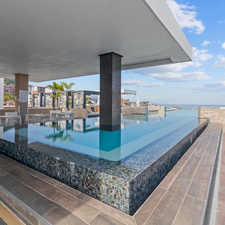 Dedicated workspace, Pool, Gym | Romantic Zone 2BR - Vacation Home - 36