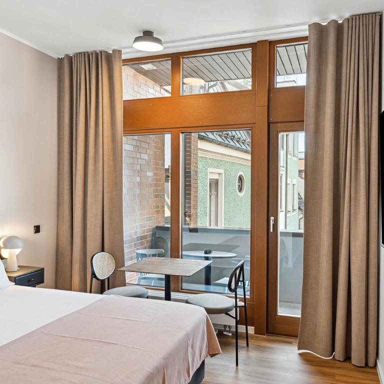Limehome Memmingen Maximilians - Suite mit Balkon - 3