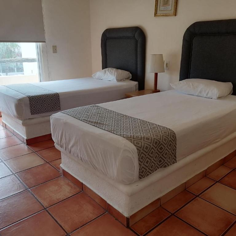 Suites Las Palmas - Habitación Doble con 2 camas grandes - 8
