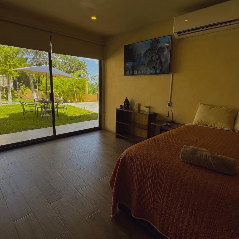 Villas Mandarina Bacalar - Habitación Triple con vistas al jardín - 7
