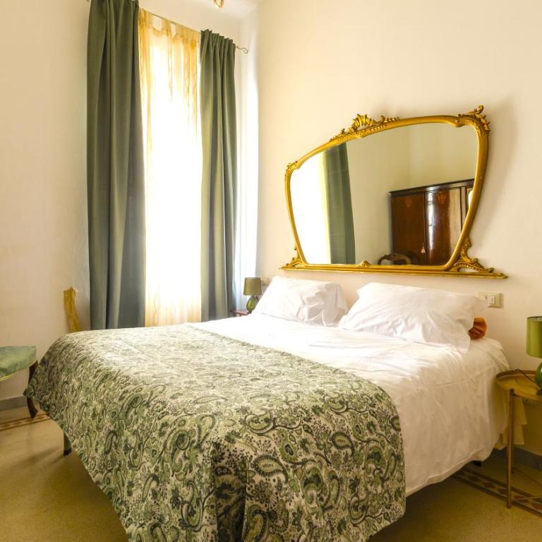 Hostly-La Casa di Marta-Two steps from the Tower - Two-Bedroom Apartment with Garden View - 3