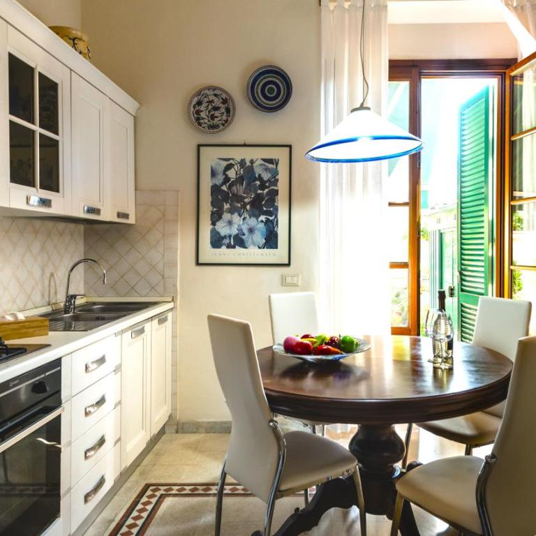 Hostly-La Casa di Marta-Two steps from the Tower - Two-Bedroom Apartment with Garden View - 8