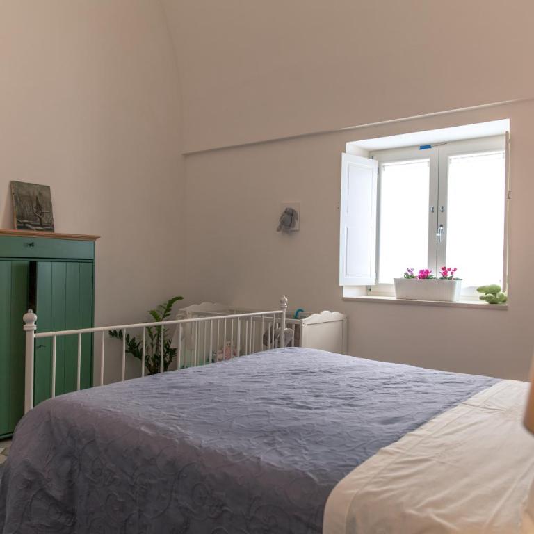 Marinella Suite Home - Camera Quadrupla con Vista Giardino - 14