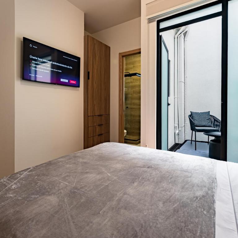 Suites Monterrey by Escajal Rooms - Habitación Deluxe - 4