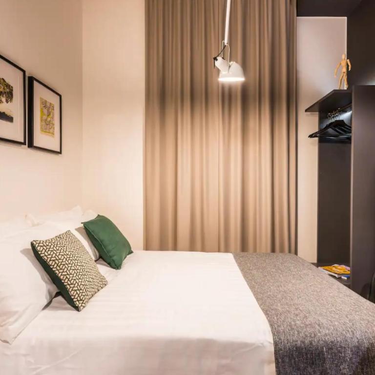 Eco Chic room with sofa bed and kitchen by Design Club Collection - One-Bedroom Apartment - 6