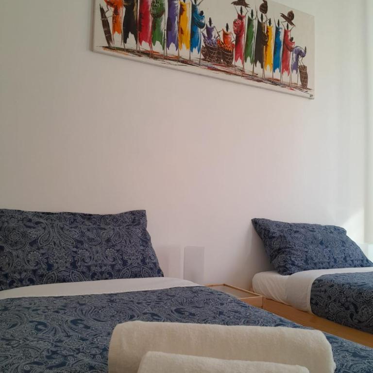 L'Iris - Camera Doppia con Letti Singoli e Bagno in Comune - 2