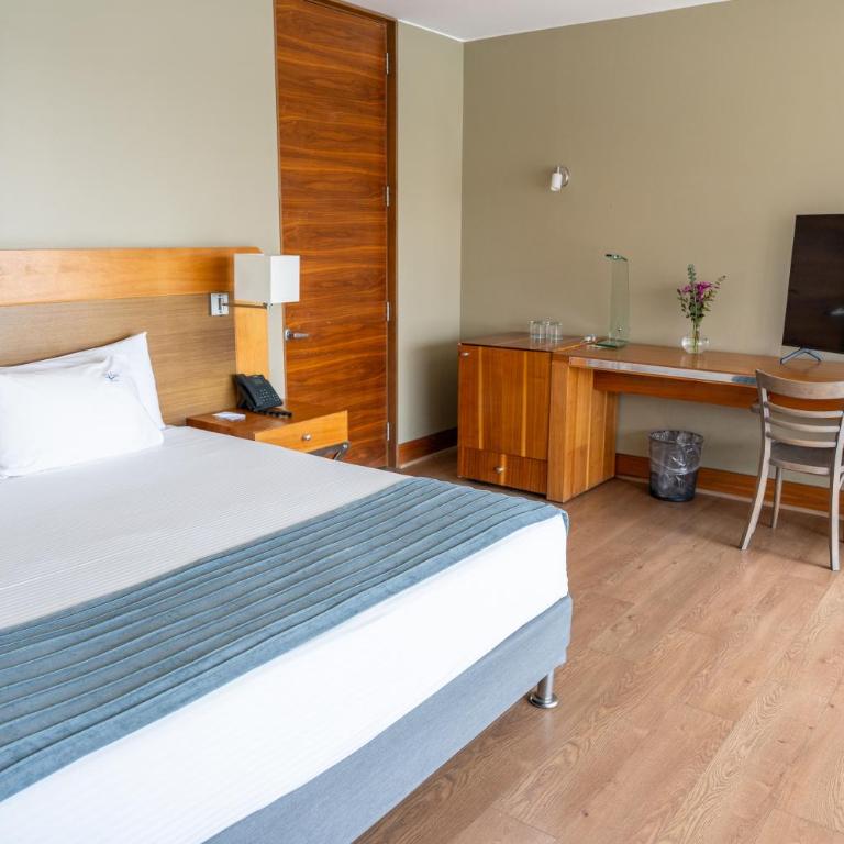 Terrado Suites Iquique - Habitación con cama grande y vistas al mar - 17