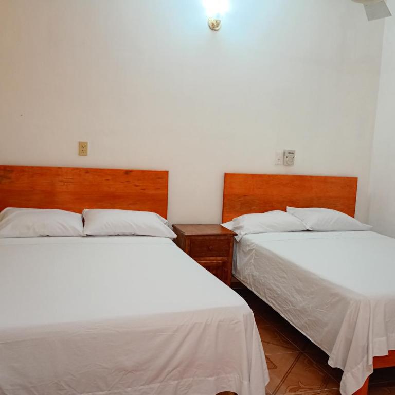Hospedaje casa Yuca - Habitación Doble Estándar con 2 camas dobles - 13