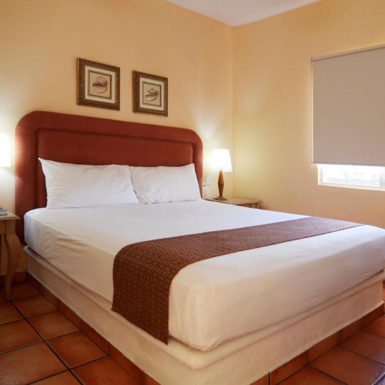 Suites Las Palmas - Habitación con cama extragrande. - 2