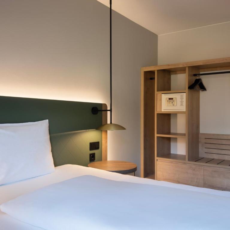 Hilton Garden Inn Innsbruck Tivoli - Zimmer mit Kingsize-Bett - 9