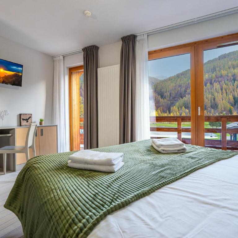 Hôtel et Camping O2 Orcières Outdoor Area - Chambre Quadruple Standard - 3