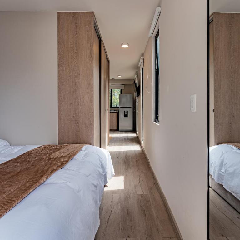 Tiny desk by VH - One-Bedroom Loft Apartment with One Queen Bed - 13