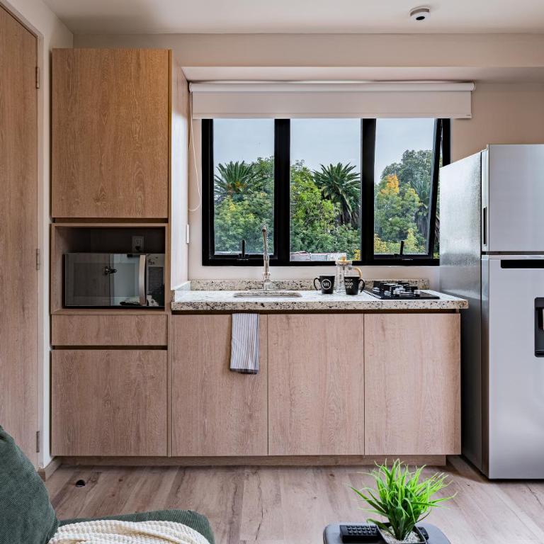 Tiny desk by VH - One-Bedroom Loft Apartment with One Queen Bed - 12