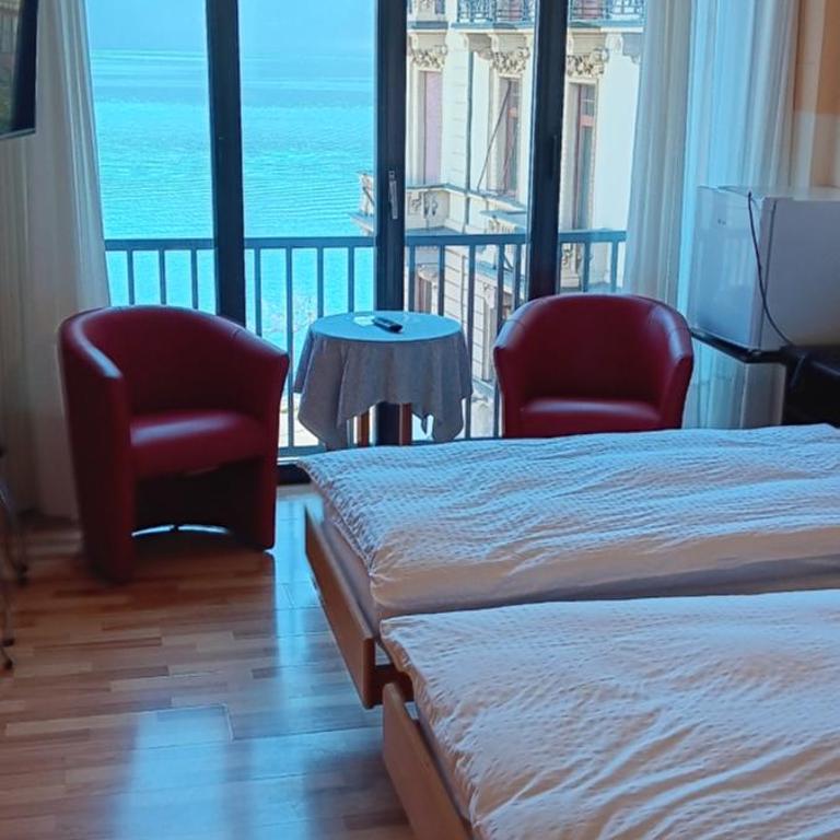 Swiss Lodge Nassa Garni - Camera Standard Doppia con Letti Singoli con Vista Lago - 2