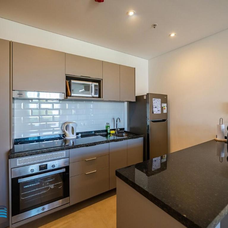 302 Emerald! Brand new and steps from the Shopping del Sol! - Two-Bedroom Apartment - 25
