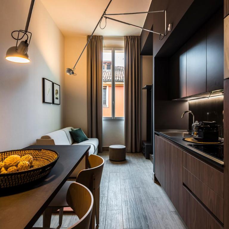 Eco Chic room with sofa bed and kitchen by Design Club Collection - One-Bedroom Apartment - 7