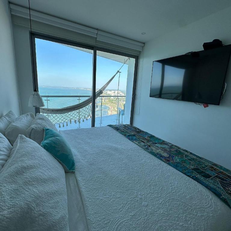 Amplios Aptos de Lujo Frente a la Playa a 5 Minutos del Centro y del Aeropuerto, en Edificio con Piscina, Jacuzzi, Sauna, Gimnasio, Turco y Seguridad las 24 hs. - Apartamento de 2 dormitorios con terraza y vistas al mar - 17