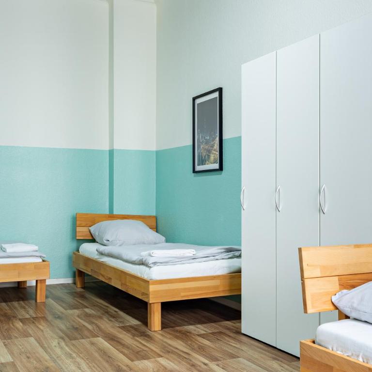 Schwanthaler Hof - Dreibettzimmer mit Gemeinschaftsbad - 18