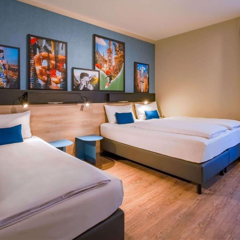 Ramada Encore by Wyndham Munich Messe - Deluxe Dreibettzimmer mit 3 Einzelbetten - 1