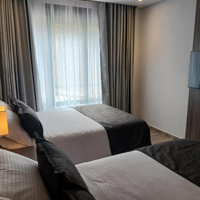 Hotel Santino - Habitación Cuádruple Clásica - 2
