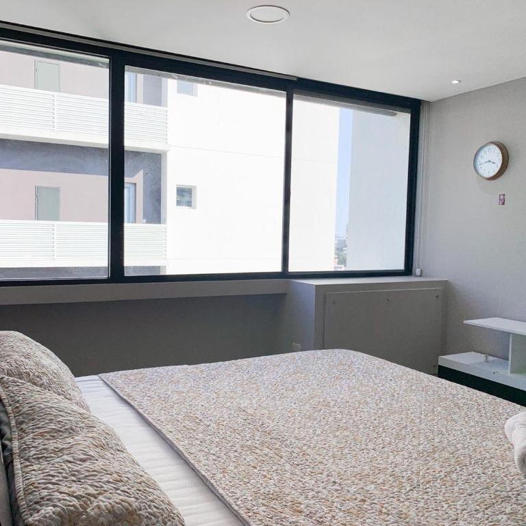 Depa familiar en piso alto vistas espectaculares - Family Two-Bedroom Apartment with View - 9