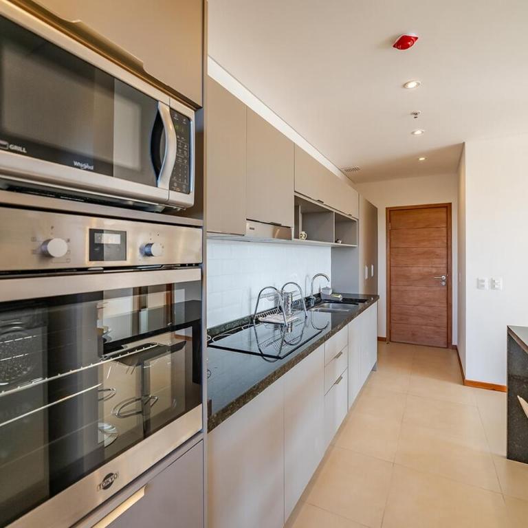 605 Emerald Boutique building just steps away from Shopping del Sol! - Two-Bedroom Apartment - 16