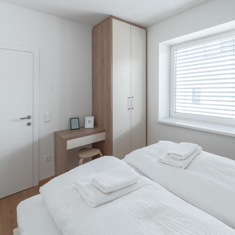 Amaria Downtown Aparthotel Villach - Deluxe Apartment mit Balkon - 12