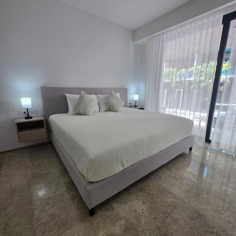 Modern Refuge Just Steps from 5th Avenue - Two-Bedroom Apartment with Balcony and Sea View - 13