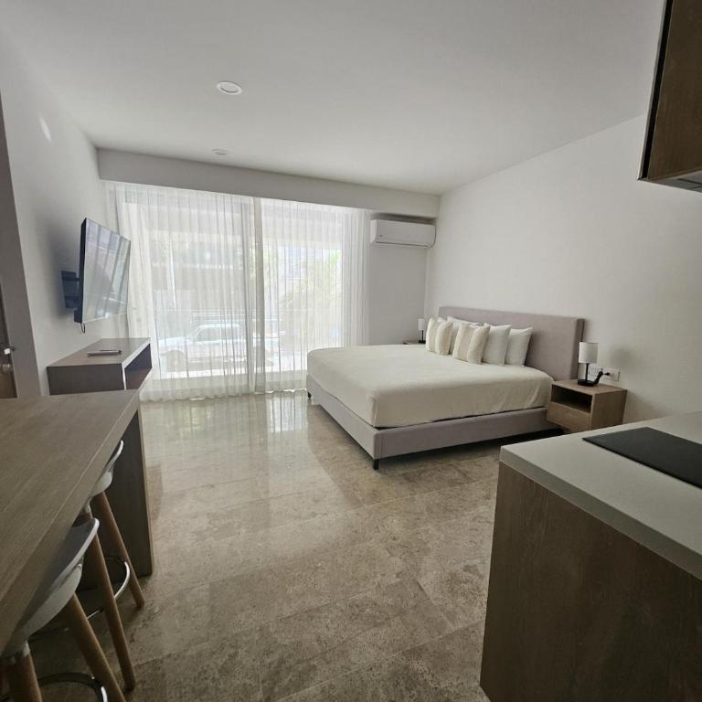 Modern Refuge Just Steps from 5th Avenue - Two-Bedroom Apartment with Balcony and Sea View - 16