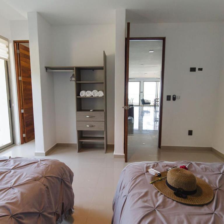 Angelina 28 Beachfront and Family Apartments - Modern and Relaxing Long Stays - 20 min from Cancun Airport - One-Bedroom Apartment with Garden - 1