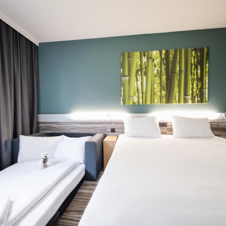 Ibis Styles Linz - Familienzimmer mit Kingsize-Bett und Schlafsofa - 11