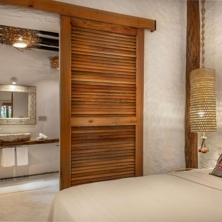 Mawimbi Boutique Hotel - Habitación Deluxe con cama extragrande - 4