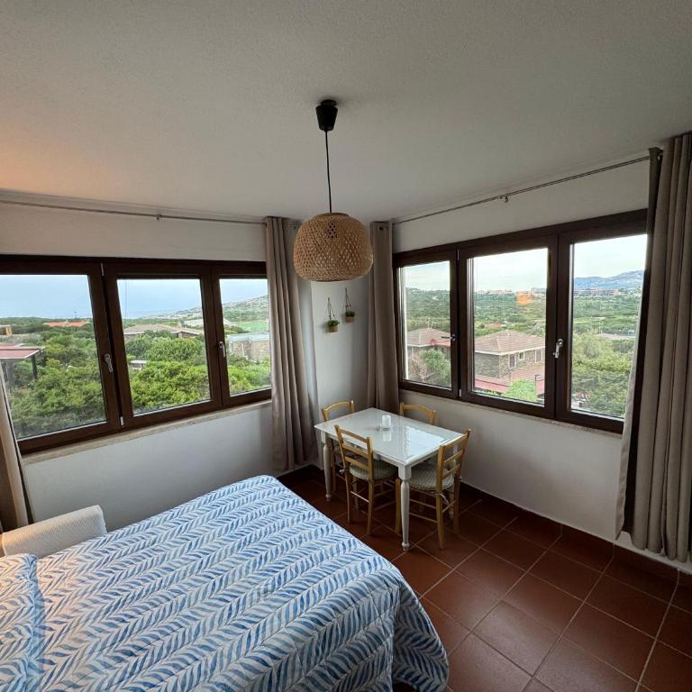 Casa con giardino, Wi-Fi e aria condizionata vicino alla Pelosa - Appartamento con 2 Camere da Letto e Vista Mare - 10