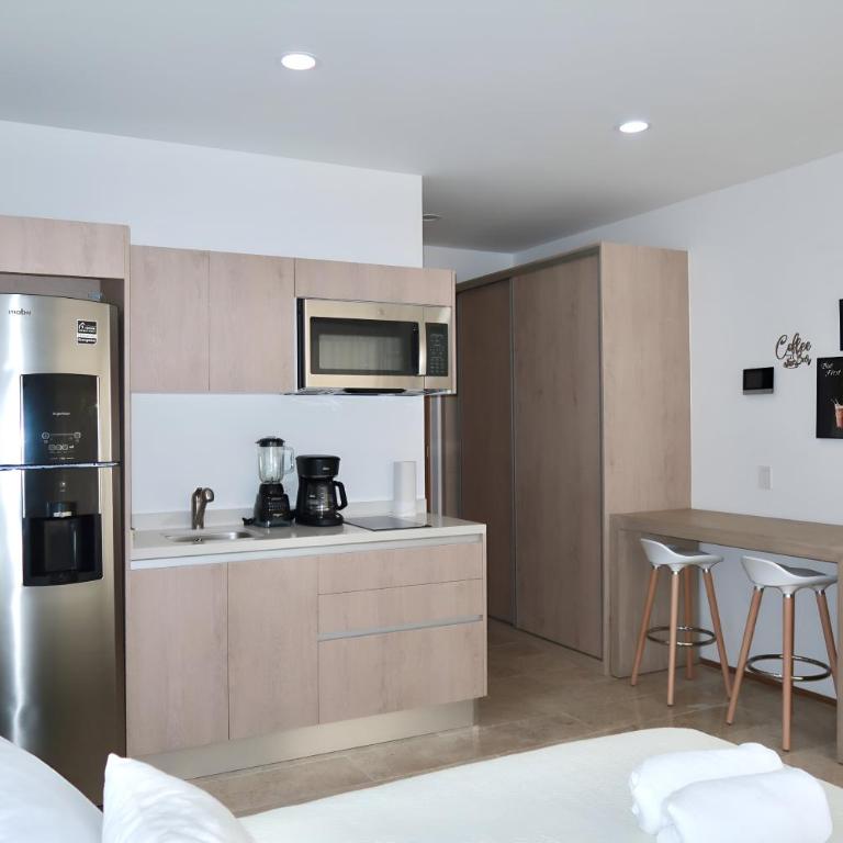 Modern Refuge Just Steps from 5th Avenue - Two-Bedroom Apartment with Balcony and Sea View - 35