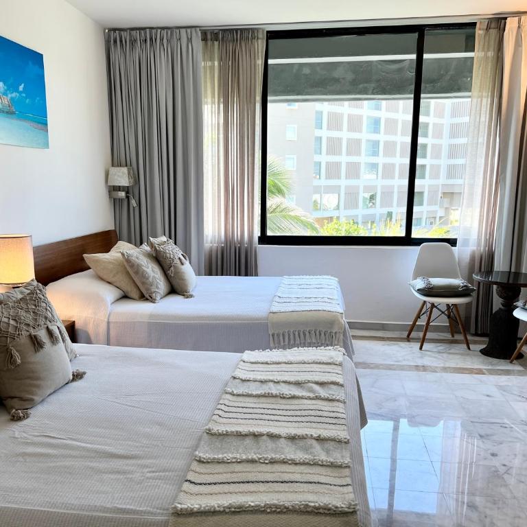 Luna, 2 Beds en la mejor ubicación de Cancún - Habitación Doble Deluxe - 2 camas dobles - 45