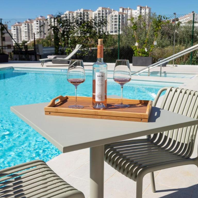 Modern 4-Person Apartment with Pool & Indoor Parking - Two-Bedroom Apartment with Garden View - 6