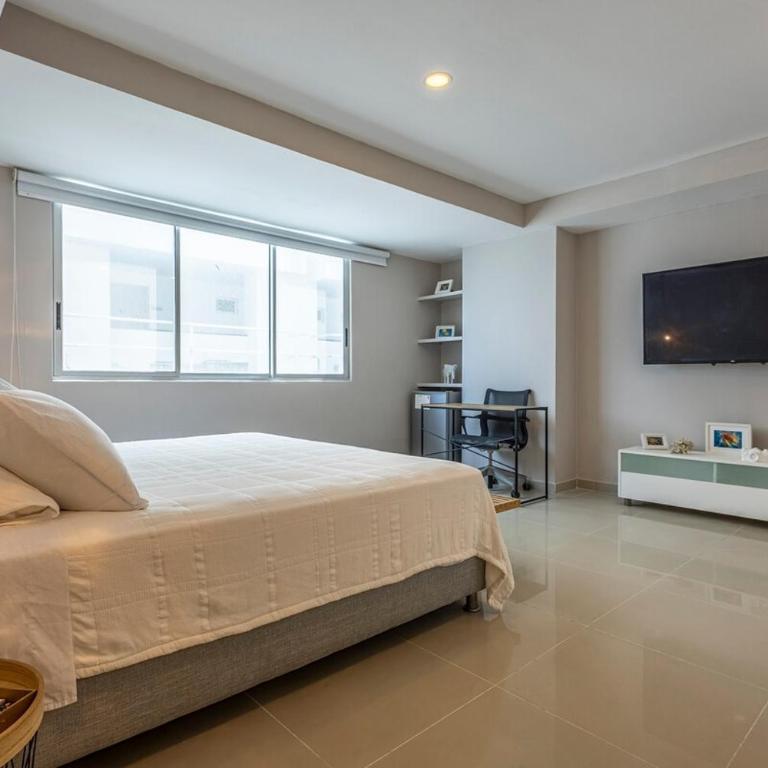 Luxurious Beachfront 3BR, Pool & Ocean Views - Three-Bedroom Apartment - 10
