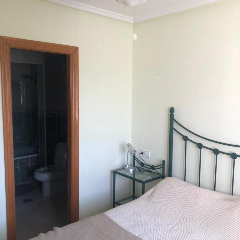 house with flowers - Three-Bedroom House - 11