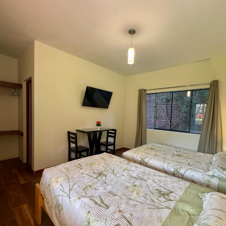 Casa Hotel Mamaluna - Habitación Triple con terraza - 12