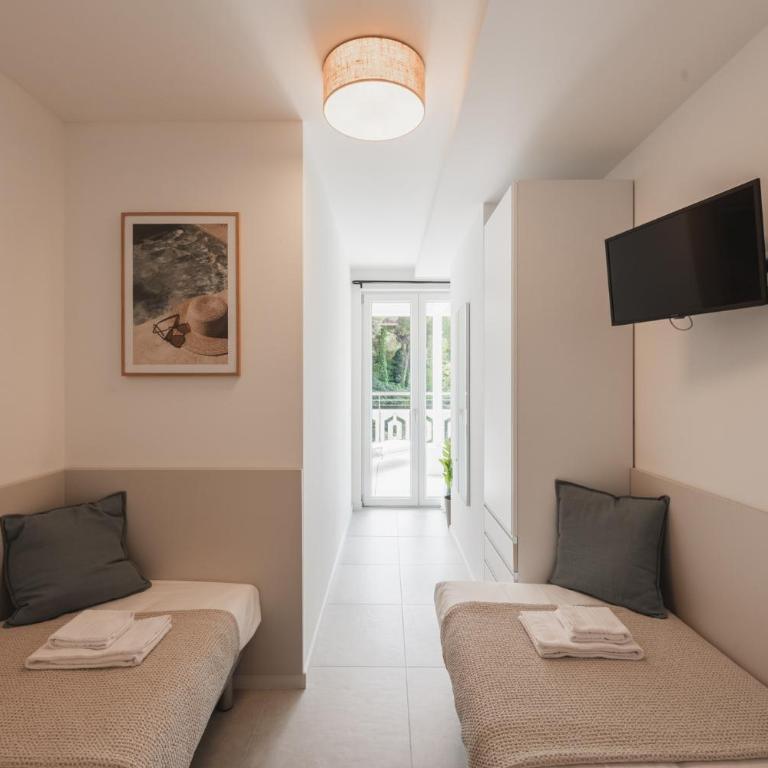 Residence Millefiori - Appartamento Deluxe con 2 Camere da Letto e Vista Giardino - 10