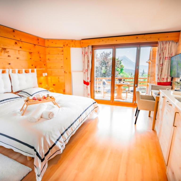 Clouds Studio Alpin Luxury View and Pool - Apartment mit 1 Schlafzimmer, Balkon und Bergblick - 1