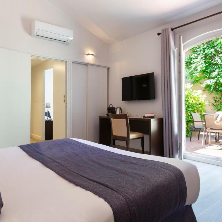 SOWELL HOTELS Domaine de la Petite Isle - Chambre Double ou Lits Jumeaux avec Accès Jardin - 1