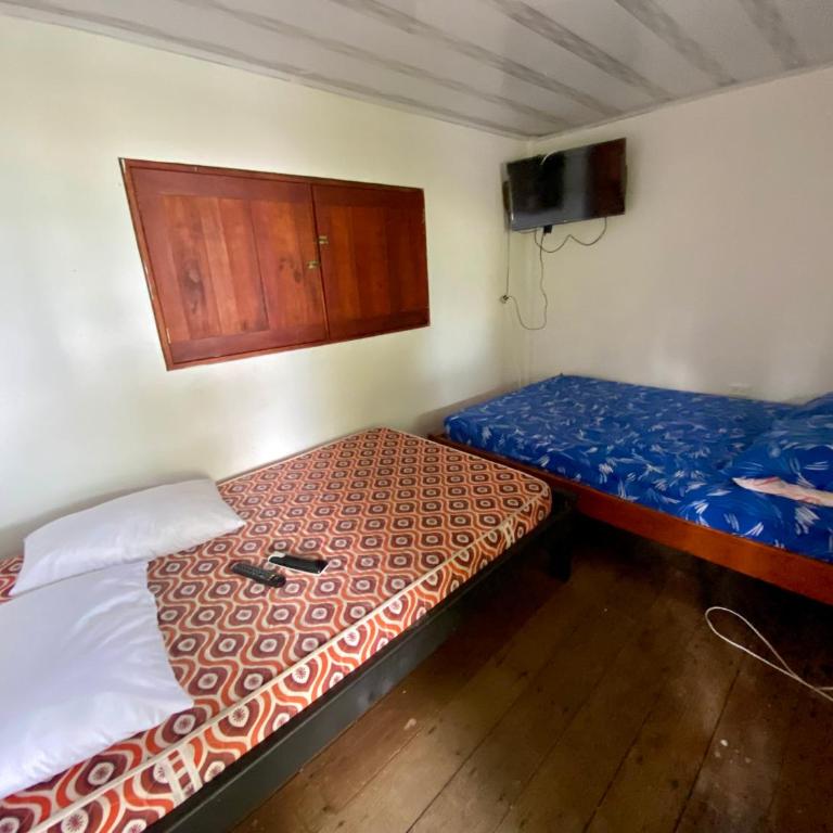 Las Perlas - Playa Huina - Habitación Doble con baño privado externo - 2 camas - 1