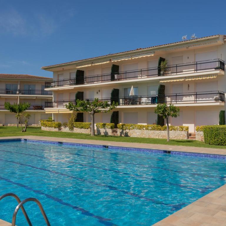 Apartament amb piscina i aparcament - Baixos amb jardinet - Apartamento de 2 dormitorios - 14