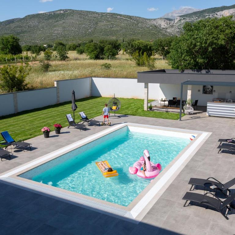 Villa One Wall - Three-Bedroom Villa - 1